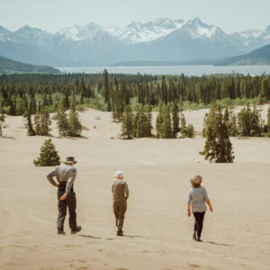 3 people walking in the Carcross Desert. Best of the Yukon